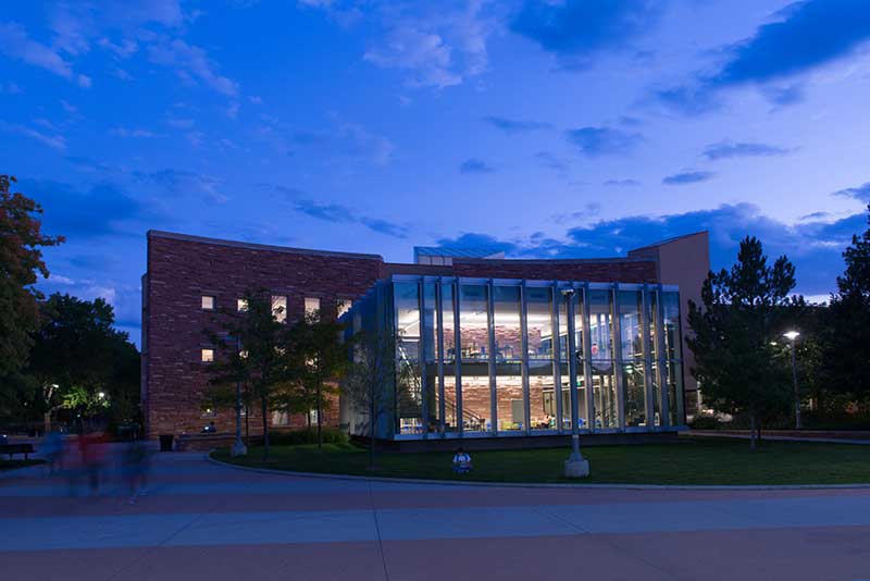 front of library and study cube at dusk