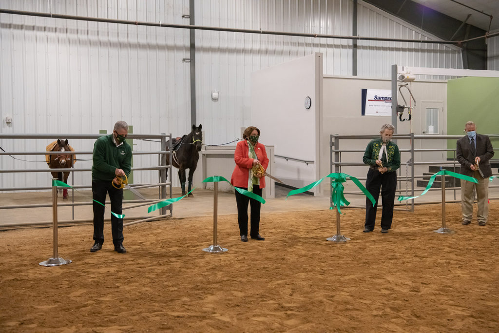 temple grandin and joyce mcconnell cutting a ribbon